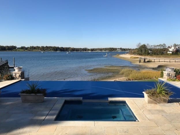 Pool with a navy automatic cover